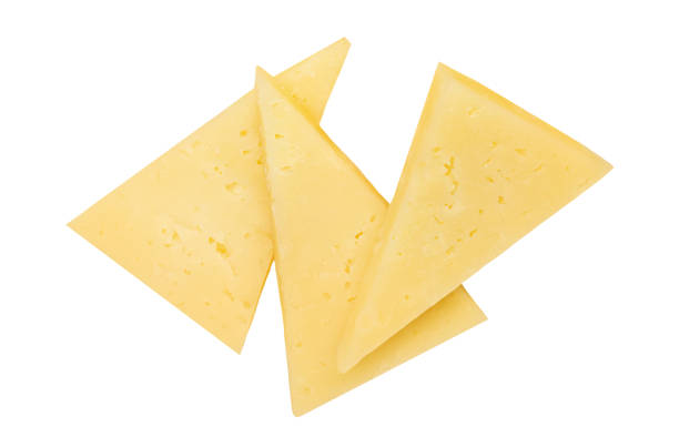Cheese triangle pieces  isolated on white background.  Swiss cheese slices collection. Top view. Flat lay
