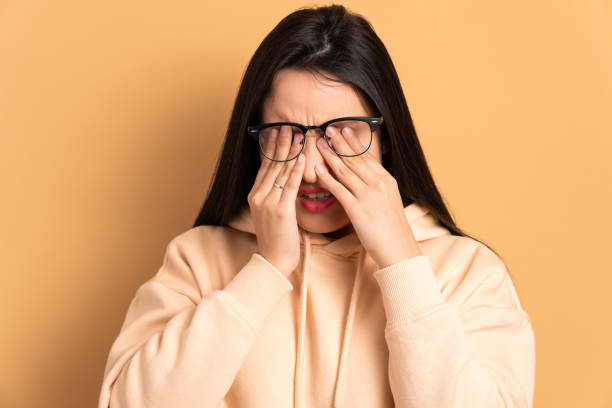 istock annoyed woman with hands over the face 1935371455