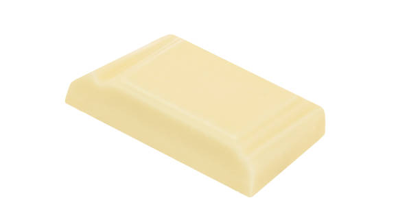 istock White chocolate pieces isolated on white background.  Chocolate Package design elements. Top view. Flat lay 1935374126