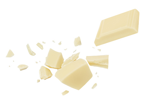 White Chocolate explosion isolated on white background. Shattering Chocolate pieces package design.