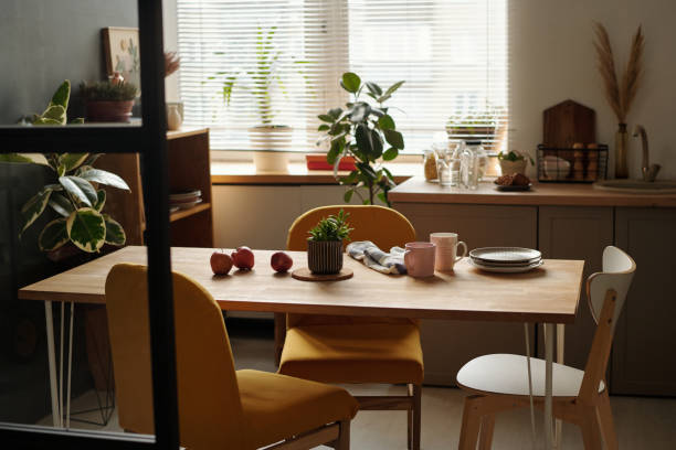 Chairs surrounding wooden kitchen table