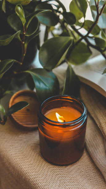 istock Burning candle in a cozy home interior 1935414050