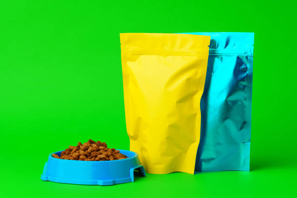 Cat food on green background in studio close up