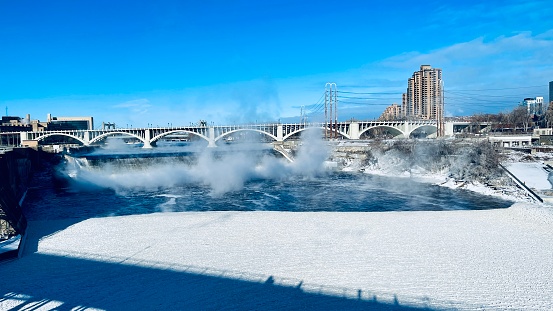Niagara Falls in winter with its surrounding covered in icy hoarfrost