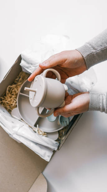 istock Unpacking baby products, silicone dishes for first feeding 1935420845