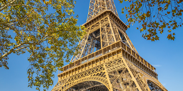 Panoramic view of the Eiffel Tower on a sunny summer day with blue sky in Paris, France