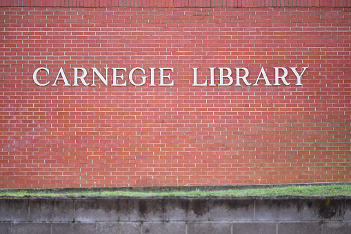 Close up of Carnegie Library sign on brick wall