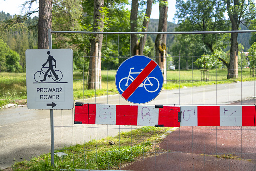 Sign prohibiting the passage of bicycles during technical work on a road on a mountain in Zakopane, Poland
