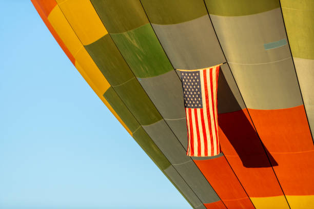 Hot air balloons with a hanging American flag