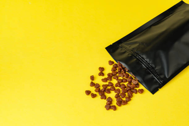 Cat food on yellow background studio shot close up