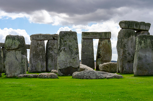 Stonehenge in Wiltshire in England in cloudy weather. It is a prehistoric monument 8 miles north from Salisbury, in the place called Wiltshire in South West England. It is under protection of UNESCO.