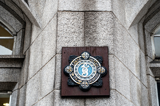 The emblem of An Garda Siochana on Pearse Street Garda Station, Dublin, Ireland.