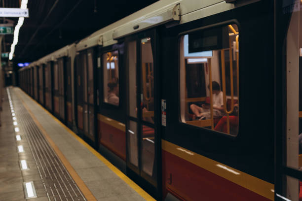 istock Empty Subway station, diminishing red train leaving the platform 1935482565