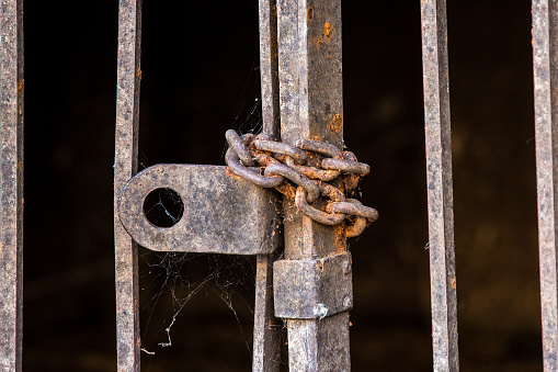 Gate chained with a rusted chain