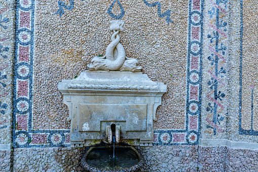 Seville, Spain - Apr 7, 2019: Fountain of the Indies and Sculptures in front of General Archive of the Indies (Archivo General de Indias) - Seville, Andalusia, Spain