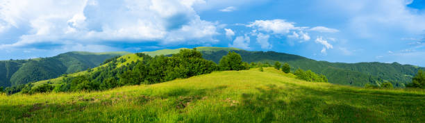istock Mountains landscapes from green meadow on sunset 1935518961