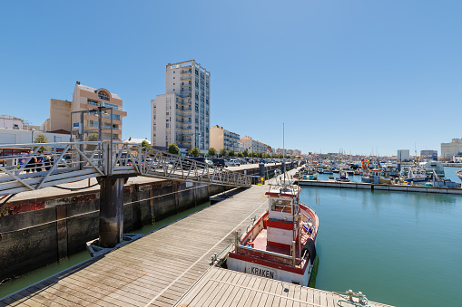 Les Sables d Olonne, France - July 10, 2022: Town fishing port and its fishing boats on a summer day