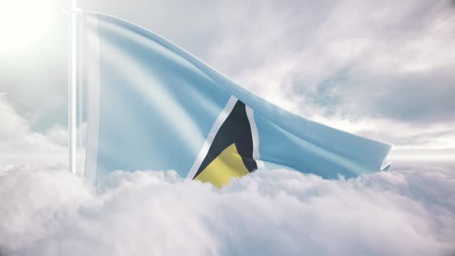 Saint Lucia giant flag rises above the clouds in slow motion, The concept of liberty, patriotism, independence day, celebration, patriotic, power. National flag waving proudly above the clouds and symbolizing freedom,