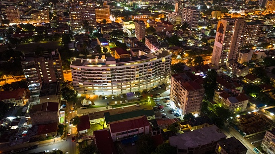 Mauto, Mozambique – May 09, 2023: An aerial photograph capturing the illuminated skyline of the distant buildings of Maputo