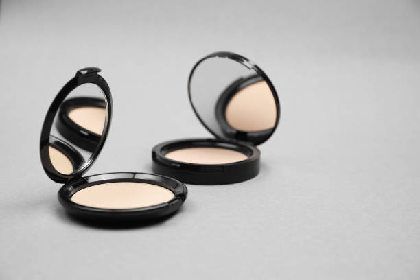 istock Open face powders with mirrors on light grey background. Space for text 1935581955