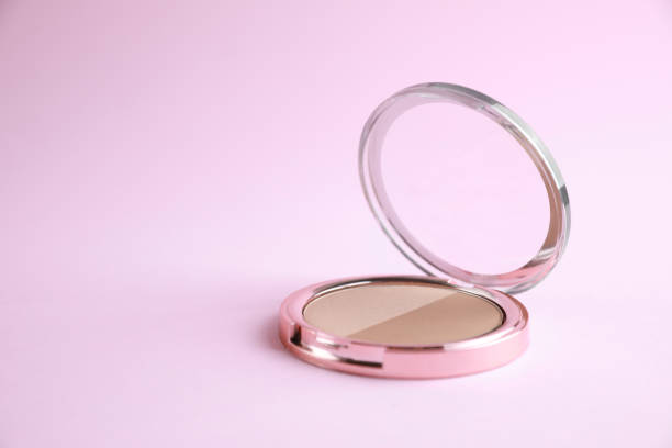 istock One face powder on pink background, space for text 1935582482