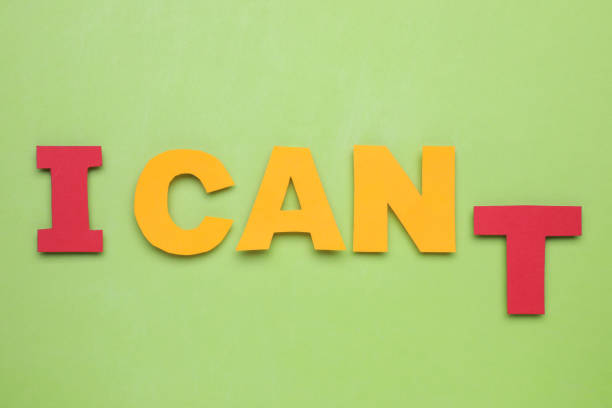istock Motivation concept. Changing phrase from I Can't into I Can by removing letter T on light green background, flat lay 1935590293