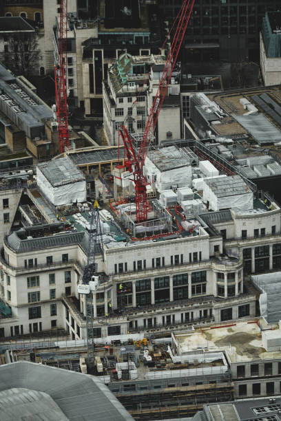 elevated view over london city skyline, construction site and development in greater london, england, united kingdom, britain - tower london england greater london inner london imagens e fotografias de stock