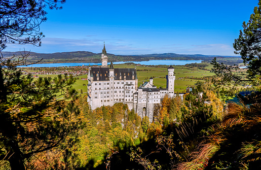 Fussen, Germany- October 25, 2023: Neuschwanstein Castle is a 19th-century historicist palace on a rugged hill of the foothills of the Alps in the very south of Germany.