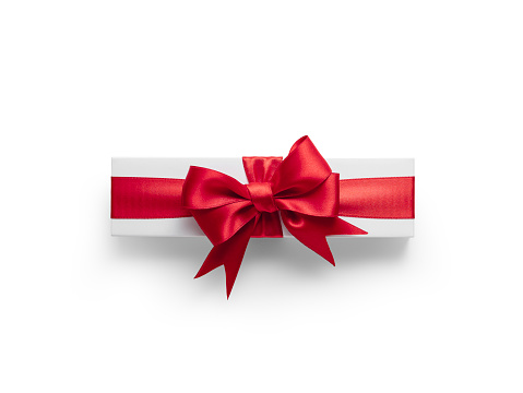 White gift box with red ribbon isolated on white background. With clipping path\nFor Valentine's Day