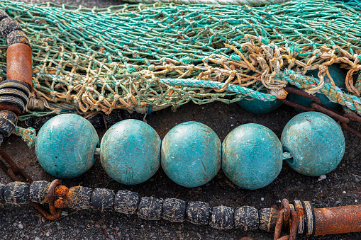 Close-up of a fishing net with floats