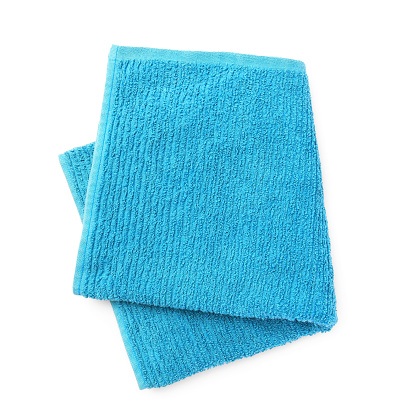 Soft blue terry towel isolated on white, top view