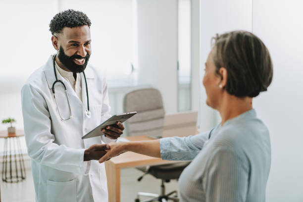 istock Doctor receiving patient in office 1935658623