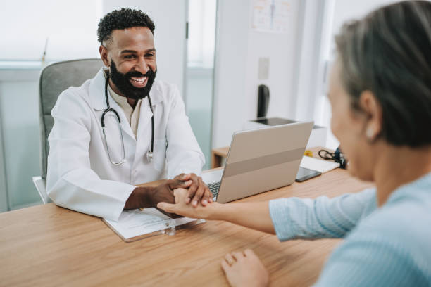istock Doctor treating patient at office table 1935659714