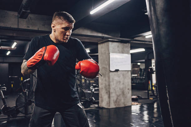 istock Male boxer training alone in gym 1935682157