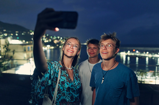 Teenagers enjoying summer vacations in Ligurian town of Rapallo. They are standing at the viewpoint and taking selfies with a view of the bay of Rapallo. Two kids are wearing modern translucent dental aligners.
Summer night in Catania, Italy.
Shot with Canon R5