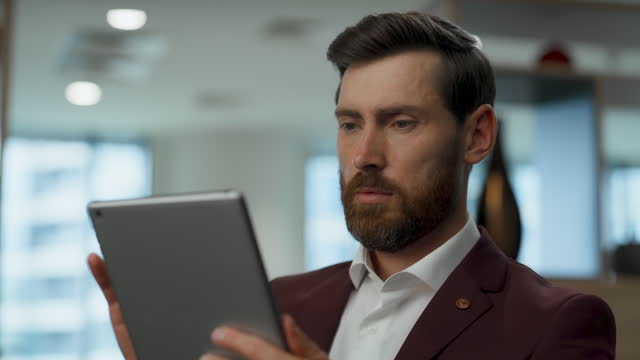 Thoughtful ceo working tablet office closeup. Businessman touching computer