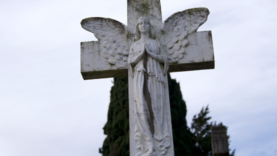 winged angel figure in a cemetery