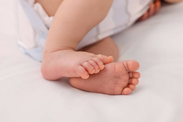 istock Newborn baby lying on white blanket, closeup 1935736139