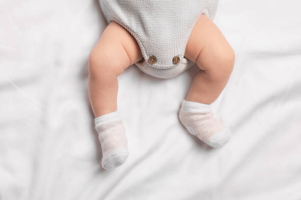 istock Newborn baby lying on white blanket, top view 1935736142