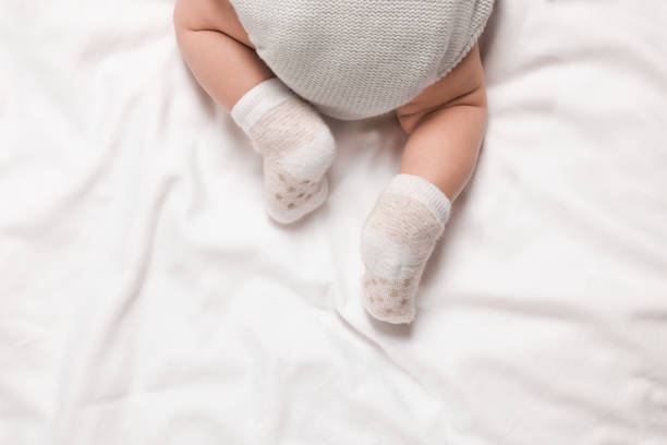 istock Newborn baby lying on blanket, top view. Space for text 1935736148