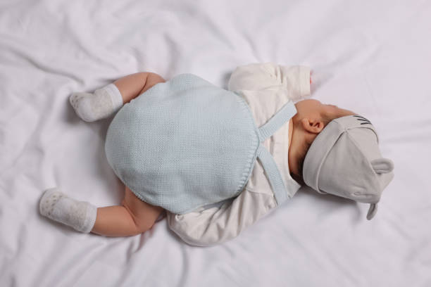 istock Newborn baby lying on white blanket, top view 1935736154