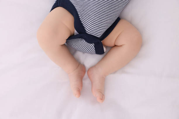 istock Newborn baby lying on white blanket, top view 1935736662