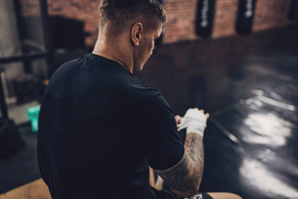 istock Male boxer wrapping bandages on hands 1935740780