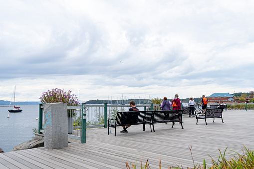 Burlington, Vermont, USA – October, 2023. People relaxing and looking over Champlain Lake at Burlington, Vermont, USA.