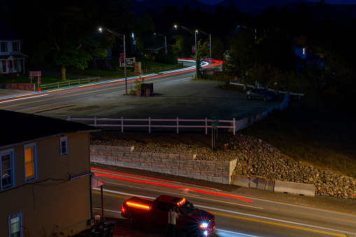 Lake Placid, New York State, USA – October, 2023. Light trails at night in Lake Placid, Vermont, USA.