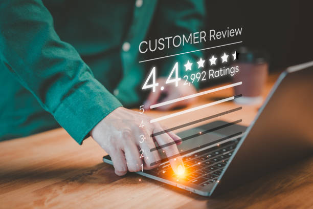 istock Customer using a computer laptop give ratings and point 4.4 stars icon for feedback review satisfaction service opinion and testimonial 1935858374
