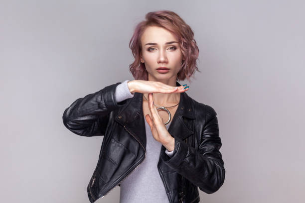 istock Adorable sad woman standing showing time out gesture, needs more time for her work. 1935889719