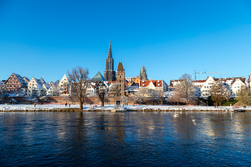 The City of Ulm with the famous, gothic minster and the old town, a winter view across Danube River, Baden Wurttemberg, Germany.