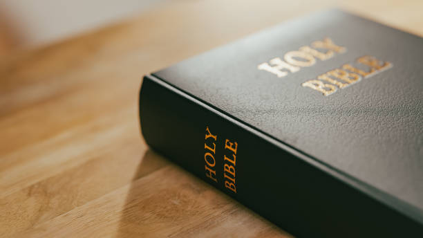 istock Background with bible on desk for prayer,3d rendering 1935947547