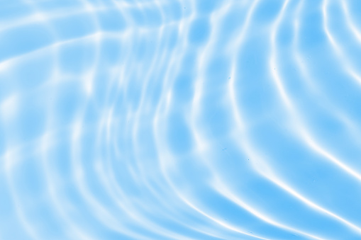 Abstract transparent water shadow surface texture natural ripple on blue background